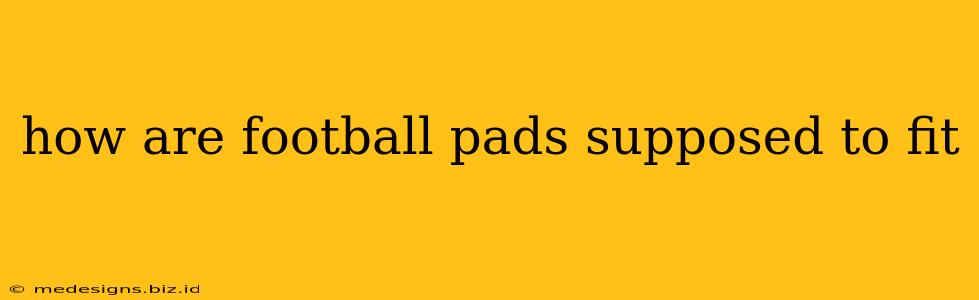 how are football pads supposed to fit