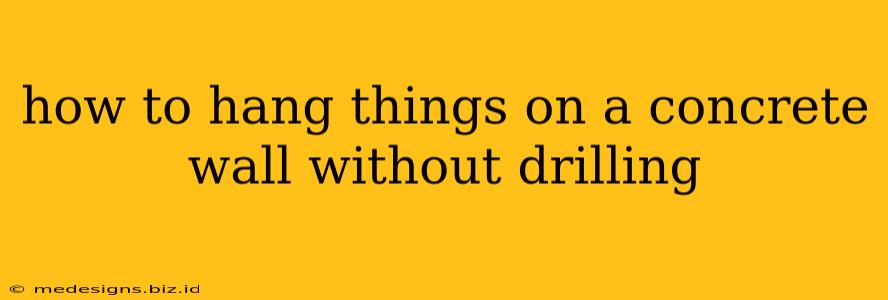 how to hang things on a concrete wall without drilling